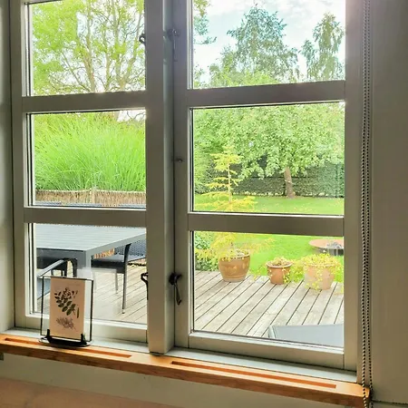 Black-painted Wooden House Overlooking Vejle Fjord * Børkop